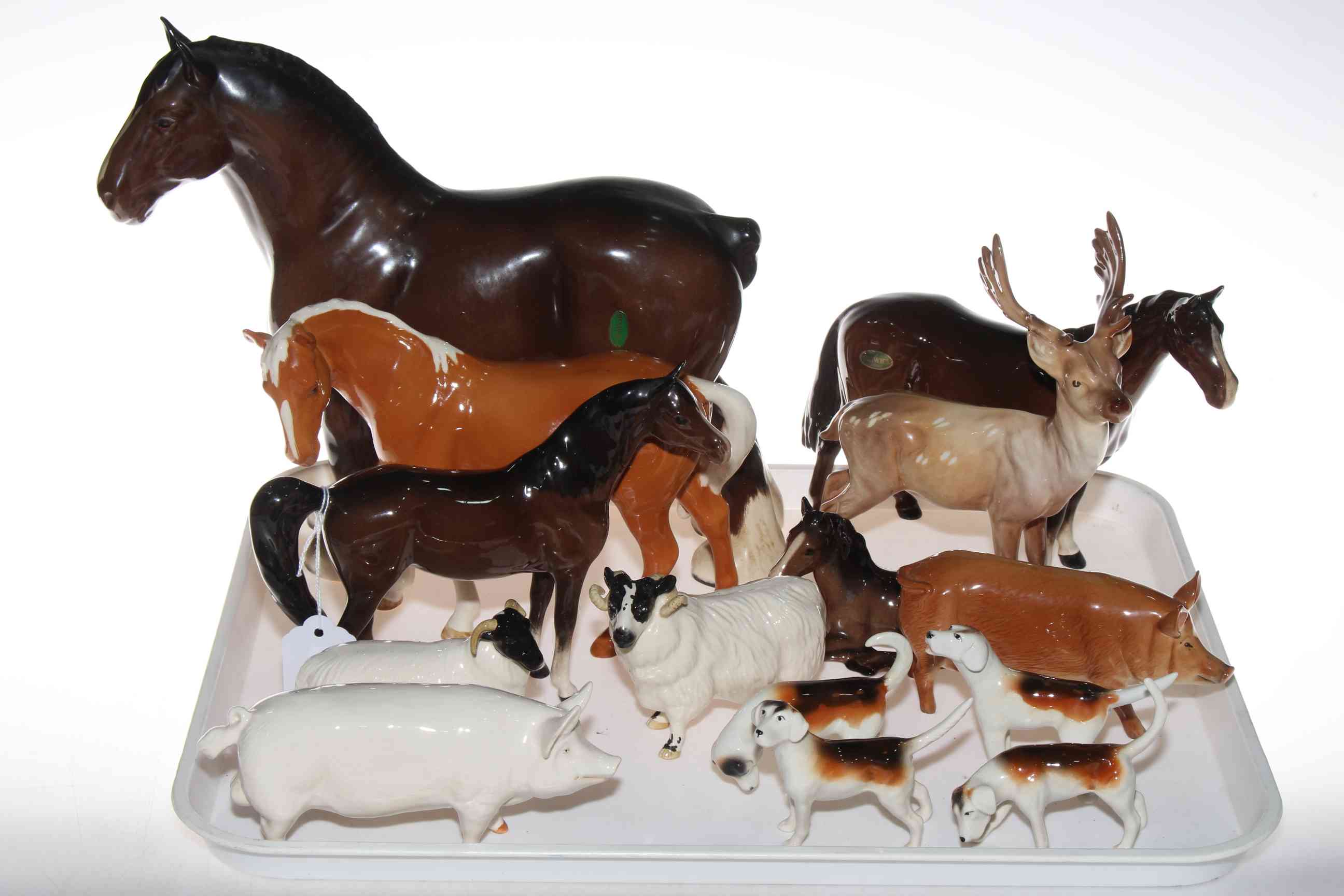 Assorted Beswick horses, foal, stag, two pigs, ram, sheep and four hounds (14).