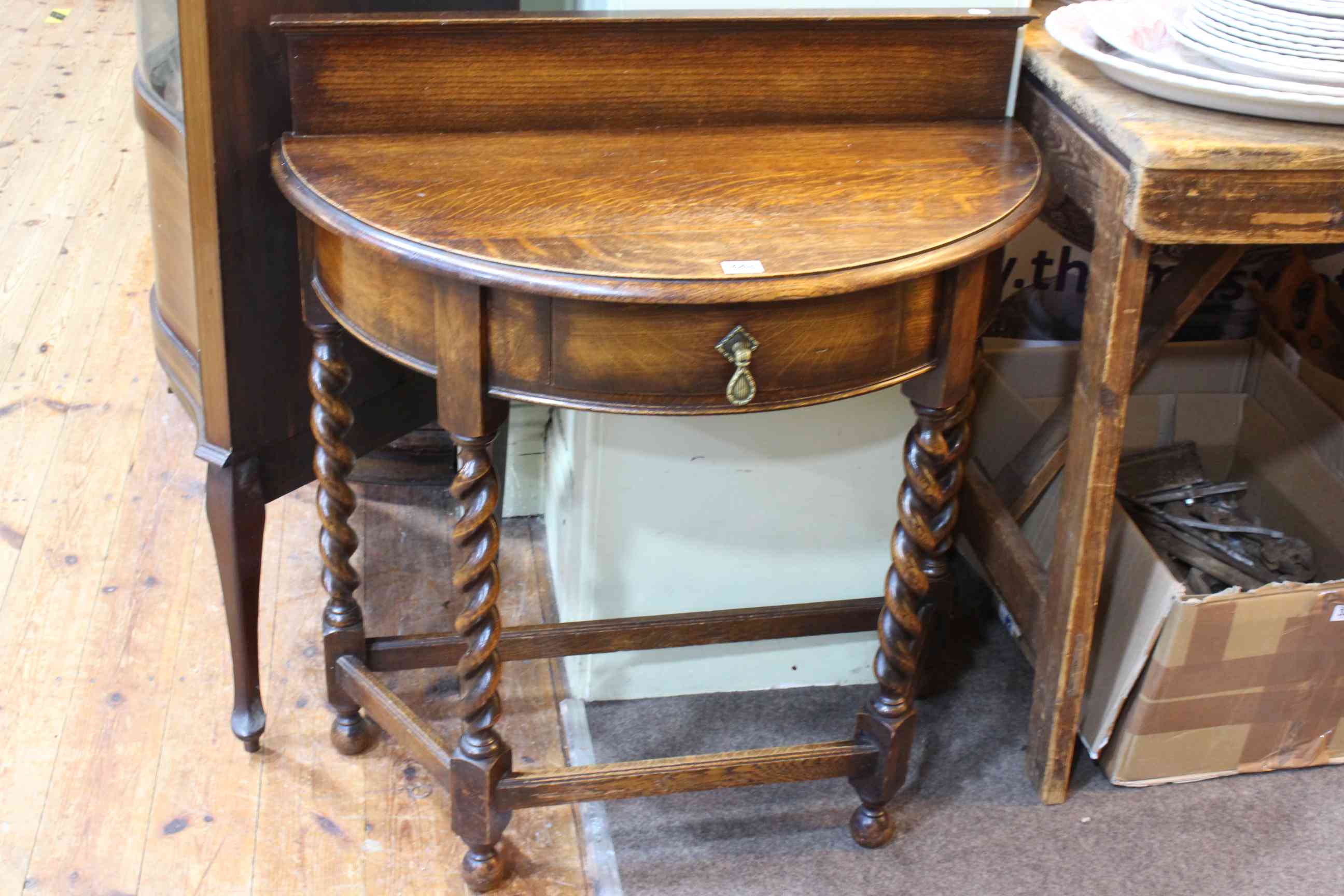 Early 20th Century oak demi-lune hall table on barley twist legs, 84 x 77cm.