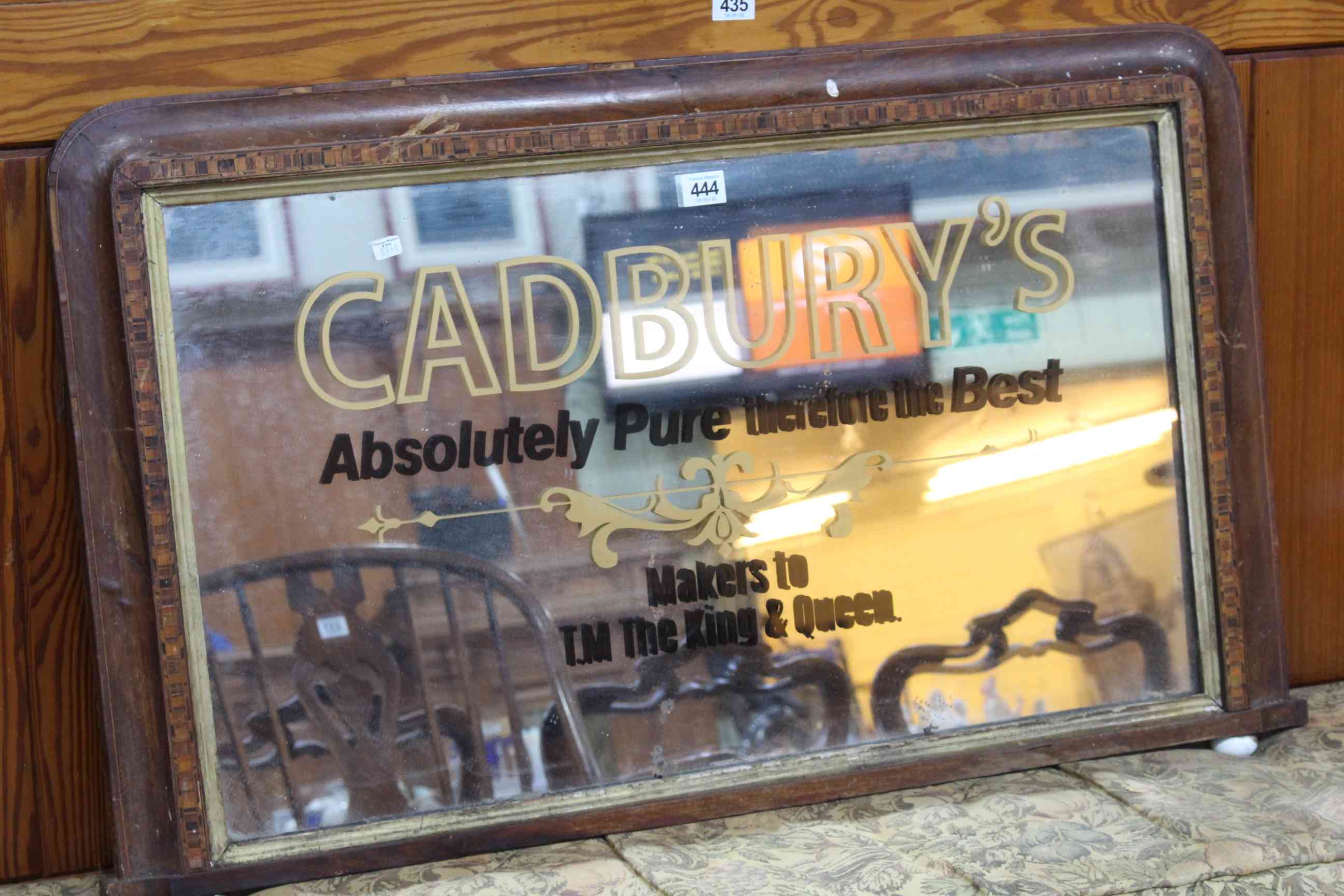 Vintage Cadbury's advert overmantel mirror in inlaid walnut frame, 54 x 87cm.