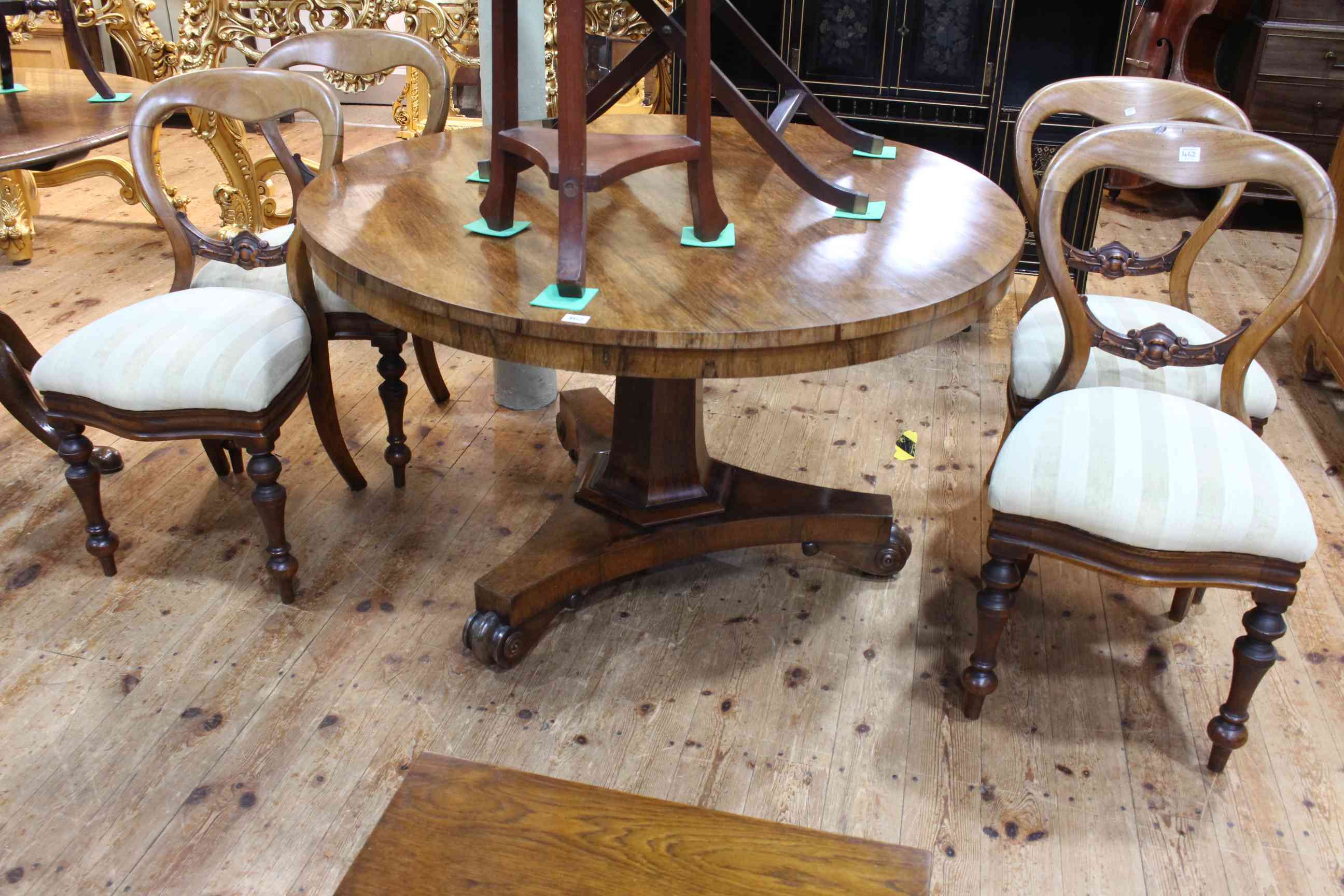 Victorian circular rosewood loo table on hexagonal pedestal to inverted triform base,