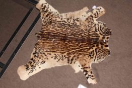 Tiger/Leopard/ocelot cub skin rug.