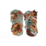 A pair of Chinese pottery wall pockets with dragon design, each 27cm long.