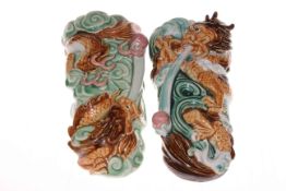 A pair of Chinese pottery wall pockets with dragon design, each 27cm long.