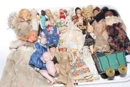 Tray of antique and vintage bisque and other dolls.