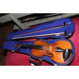 Cased Violin with two bows.