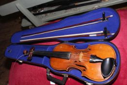 Cased Violin with two bows.