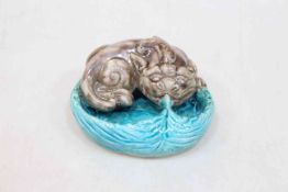 Chinese porcelain brush washer modelled as an aubergine glazed bixie upon turquoise leaf.