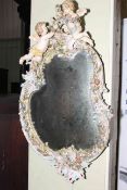 Large Continental cherub and floral decorated porcelain framed mirror, 85 x 48cm.