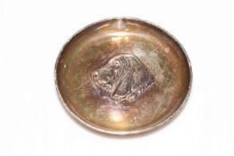 Circular silver dish with central embossed bloodhound's head, Birmingham 1910.