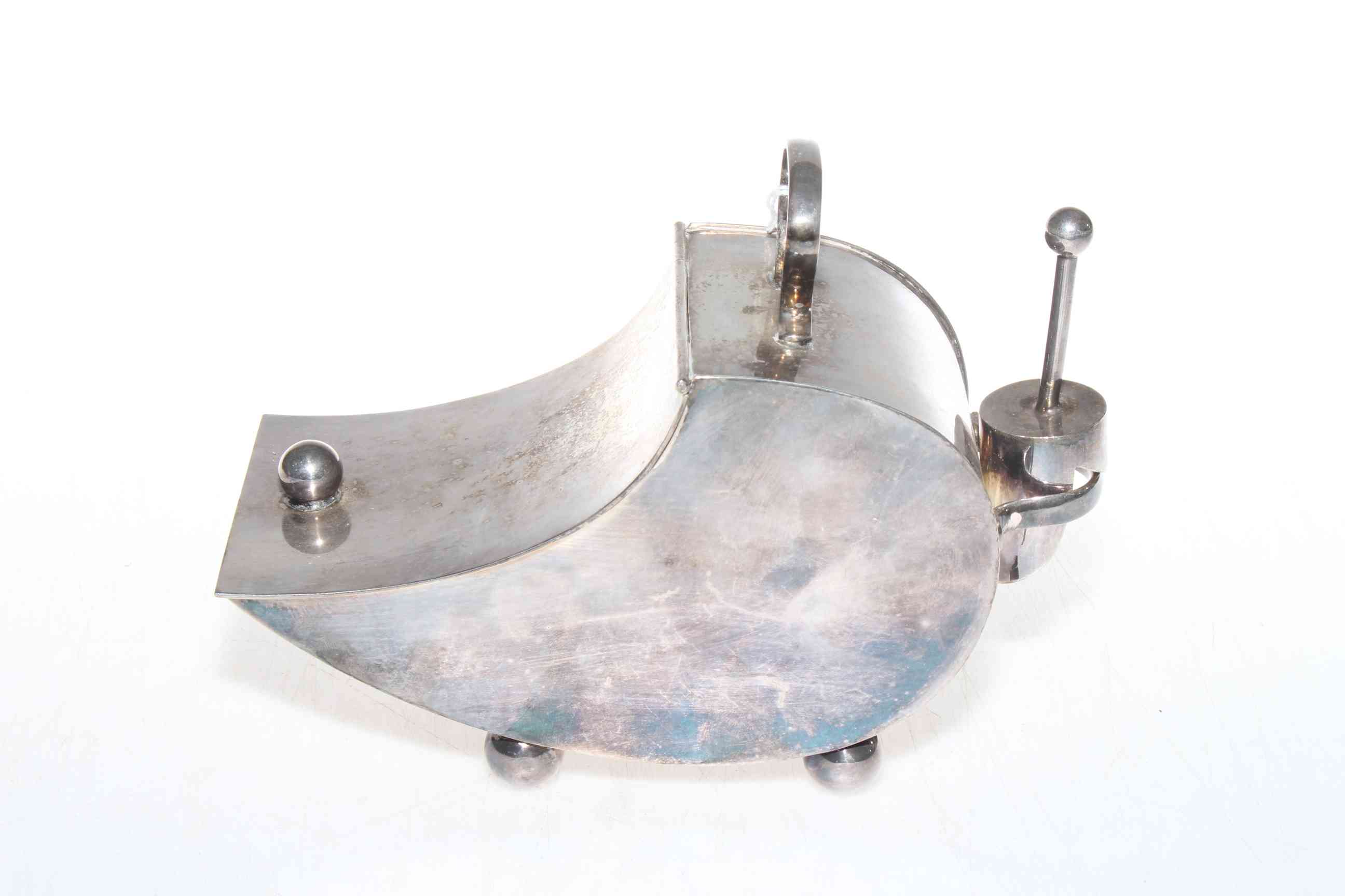 Silver plated sugar scuttle with shovel, in the manner of Christopher Dresser.