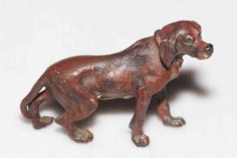 A cold painted small bronze figure of a standing gun dog, probably Austrian, circa 1900, 5cm high.