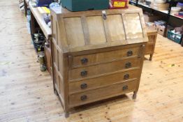 In the manner of Robert Thompson jointed oak and adzed cut four drawer bureau, 106 x 91 x 47cm.