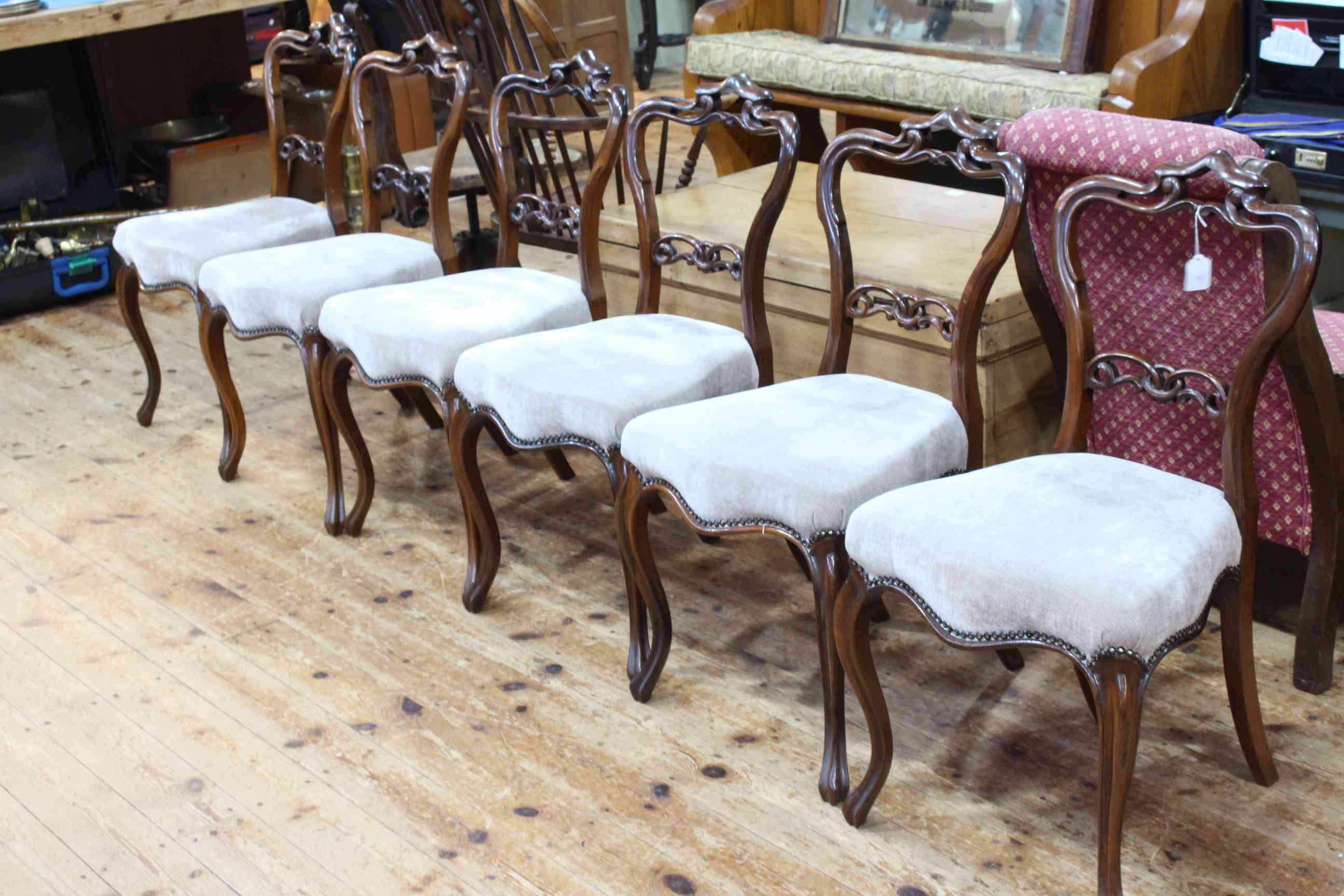 Set of six Victorian rosewood parlour chairs with serpentine front seats.