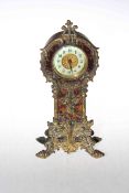 Ornate gilt metal and tortoiseshell shell longcase design mantel clock.