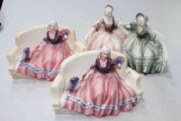Three Katzhutte figures of ladies on couches, largest 32cm across, 20cm high.