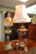 Victorian brass oil lamp with an orange etched shade, 70cm, and a copper samovar lamp, 88cm.