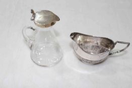 Silver topped vinegar bottle and small silver cream jug (2).