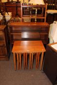 Teak nest of four drop leaf tables, teak sliding glazed door bookcase,