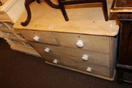 Stripped pine chest of two short above two long drawers.