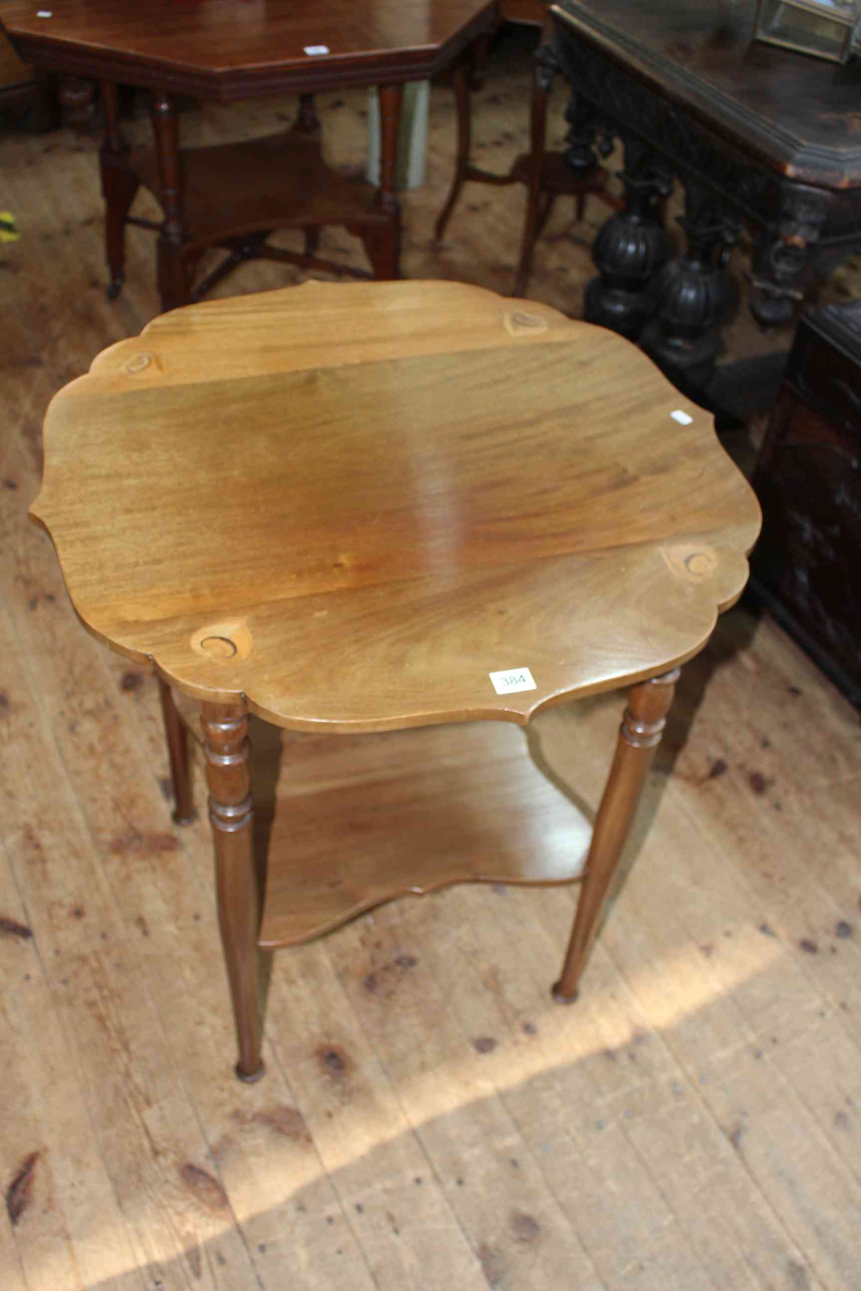 Arts & Crafts inlaid circular shaped top occasional table raised on turned legs joined by
