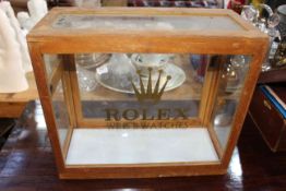 Display cabinet marked Rolex, 36cm by 42cm by 20cm.