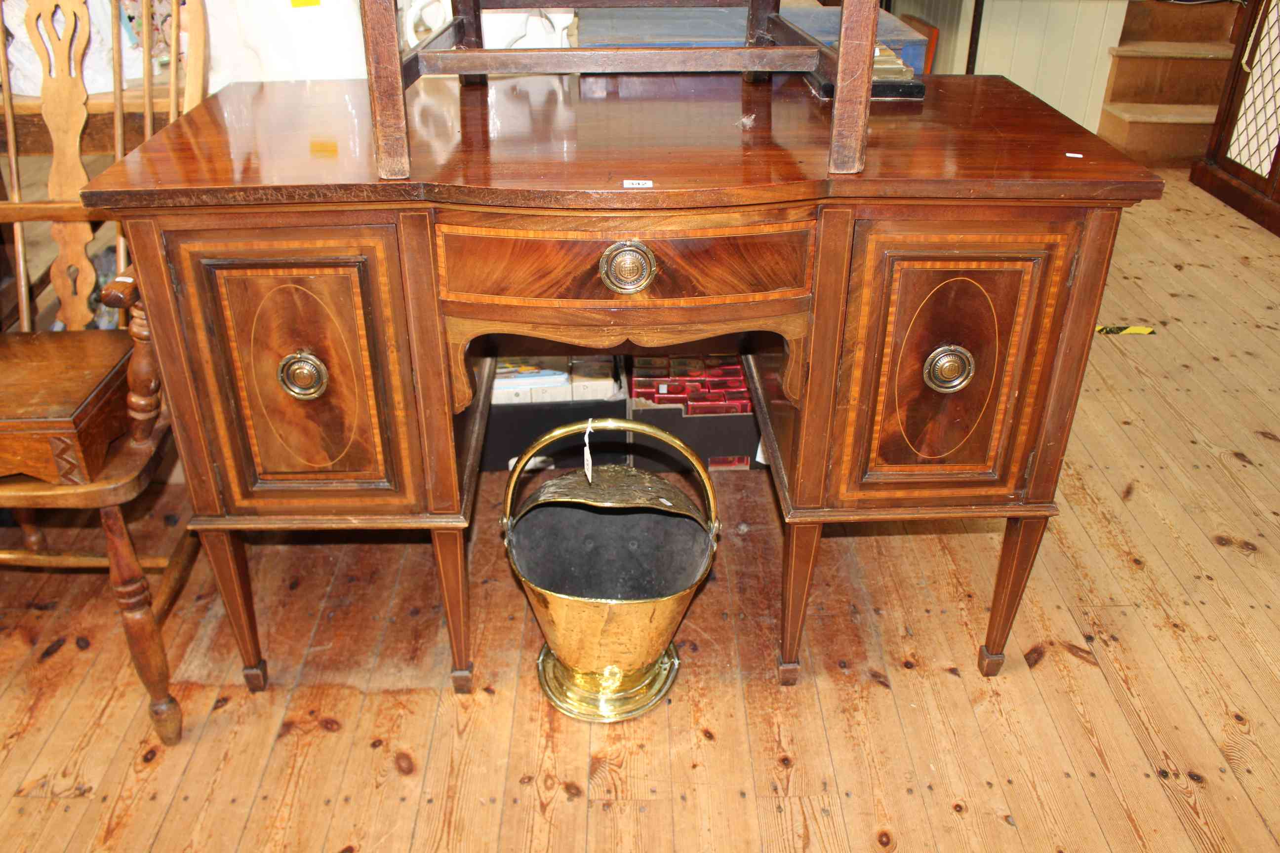 Shoolbred & Co inlaid mahogany side cabinet, the bow front central drawer flanked by two cupboard