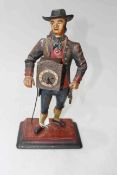 Continental painted cast metal novelty clock peddler, 38cm by 20cm by 12cm.