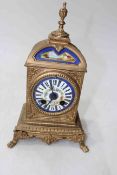 Victorian gilt metal mantel clock with painted porcelain dial and plaque, 29cm.