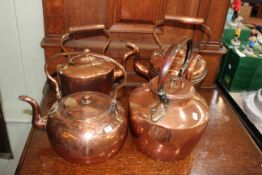 Four copper kettles.