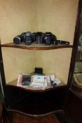 Minolta camera with lens, Practica camera and lens, Pentax camera.