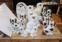 Fourteen Staffordshire figurines, majority dogs.