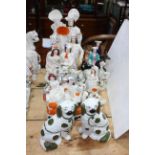 Twelve Staffordshire figurines including Zebra, dogs, posy holders, etc.