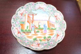 Chinese scalloped edge plate painted with figures, 17cm diameter.