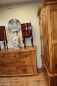 Hardwood arched top double door combination wardrobe together with a matching seven drawer chest.
