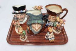 Three Royal Doulton character jugs and five Hummel figures.