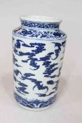 Chinese blue and white cylindrical vase, decorated with bats and fire forms, blue mark to base,