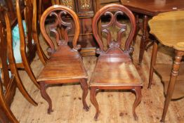 Pair Victorian mahogany balloon shaped back hall chairs.