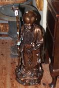 Large bronzed effect figure of an Oriental Elder, 86cm high.