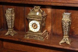 Ornate gilt metal three piece garniture clock set, clock 27cm high.