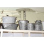 Two galvanised oval tubs, large and small buckets and large and small pails.