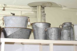 Two galvanised oval tubs, large and small buckets and large and small pails.