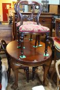 Late 19th/early 20th Century oval mahogany dining table on ball and claw legs,
