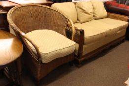 Early 20th Century bergere panelled three seater settee and basket weave armchair.