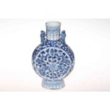 Antique Chinese blue and white moon flask vase with dragon, foliate and blossom decoration, 25cm.
