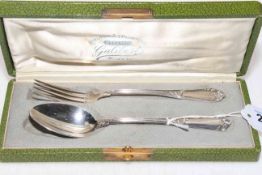 Cased French silver dessert spoon and fork with ornate handles.