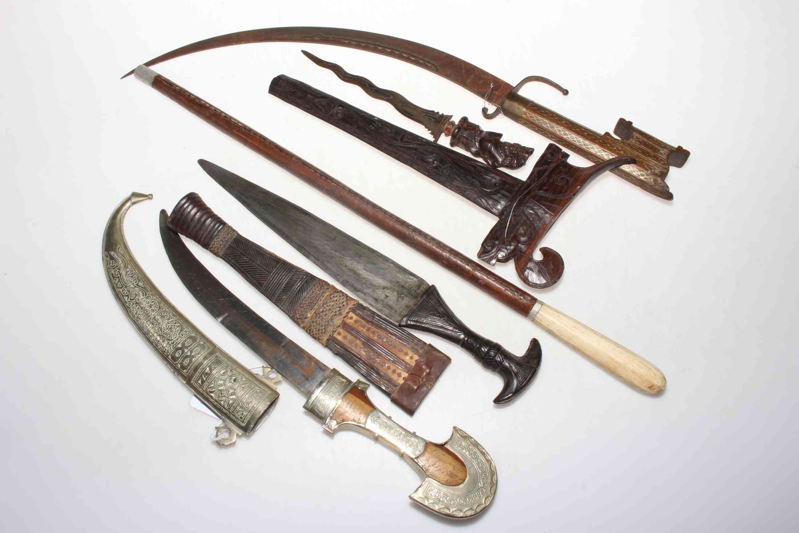 Collection of four Eastern daggers, and leather bound baton (5). - Image 2 of 2