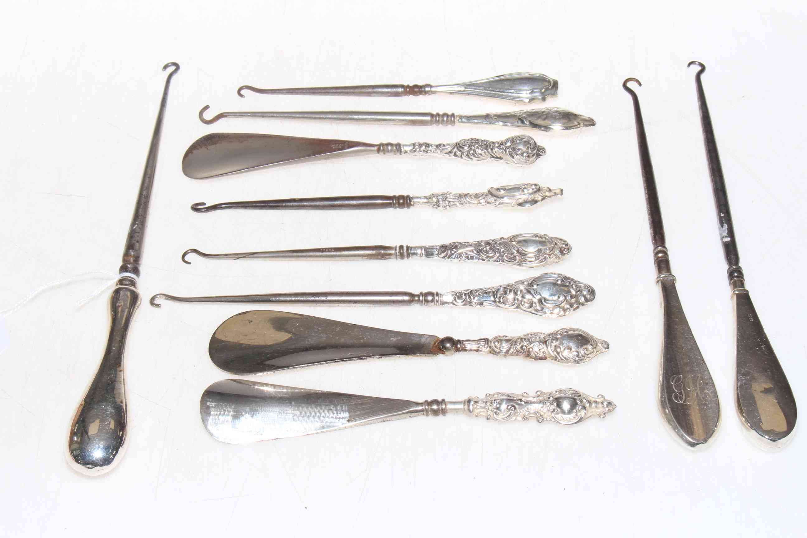 Collection of silver handled button hooks, etc.