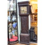 Antique carved oak 30 hour longcase clock having square brass dial signed Tho's Lister.