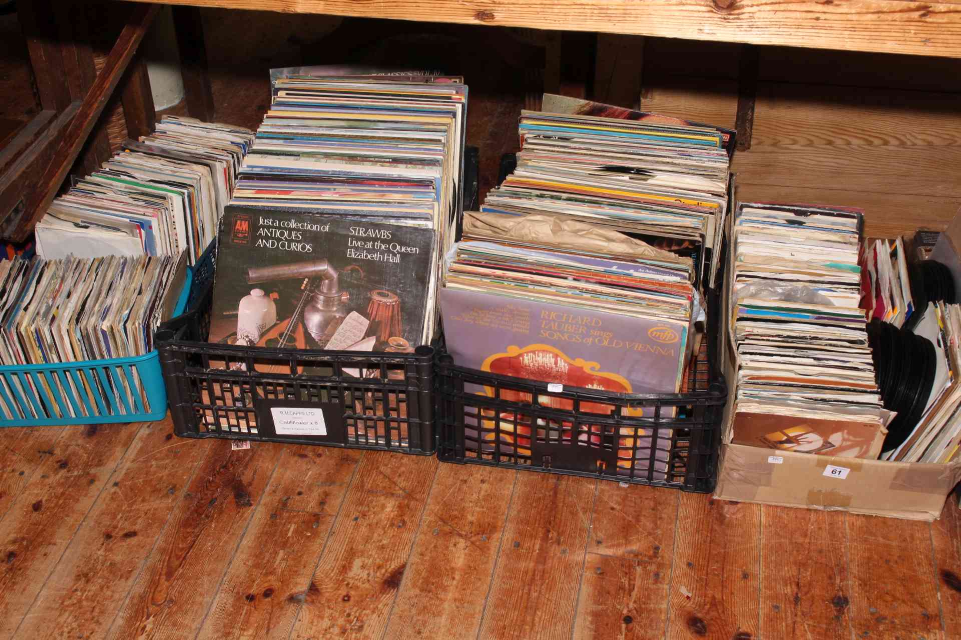 Five boxes of vinyl records and singles.
