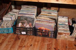 Five boxes of vinyl records and singles.